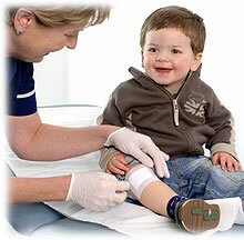 Little boy having a dressing applied